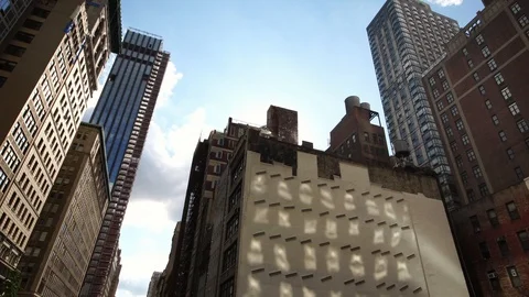 Low angle moving shot of NYC New York City Manhattan skyscraper buildings Stock Footage 96518713