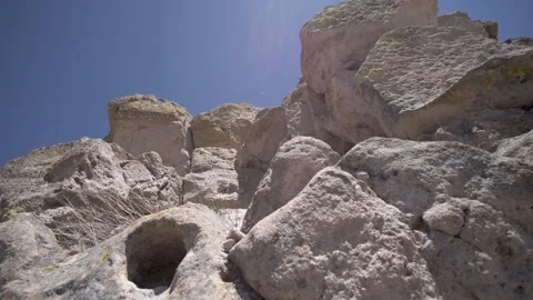 Low angle moving shot of rocks during the day Stock Footage 160808226