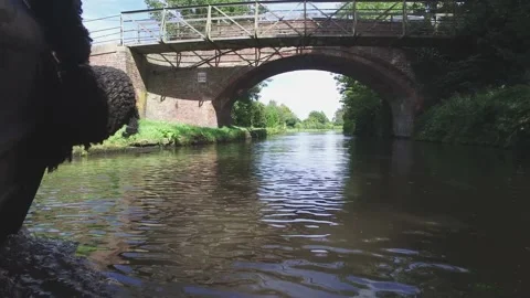 Low angle Narrowboat sailing along a canal Stock-Footage 138319686