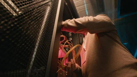 Low Angle of Network Engineer Repairing Broken Cables Stock Footage 311306648