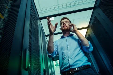 Low angle of a nice busy young man Stock Photos