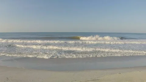 Low Angle Ocean and Sand Aerial Stock Footage 109191326