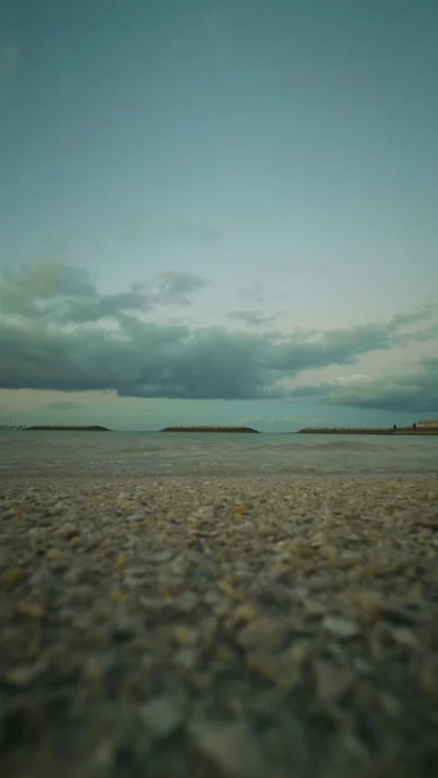 Low angle ocean wave rolling over camera lens on beach Stock Footage 346267903