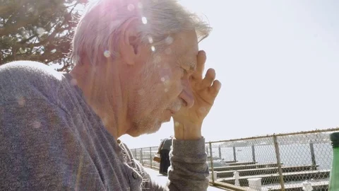 Low angle of an old man sitting and reading or speaking aloud Video stock 87787070