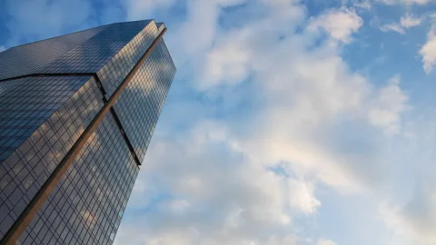 Low angle overhead time-lapse of downtown high-rise glass skyscraper sunny day Stock Footage 317174015