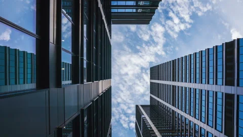 Low angle overhead time-lapse of downtown high-rise skyscrapers on sunny day Stock Footage 317174178