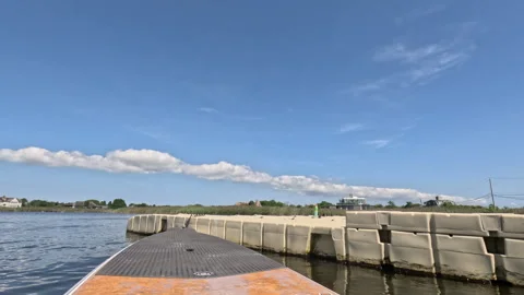Low-angle Paddleboard POV in Mecox Bay, a beautiful day in The Hamptons Stock Footage 253970403