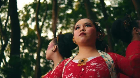 Low Angle Pan Across Faces of Javanese Women in Traditional Dress Stock Footage 263947207