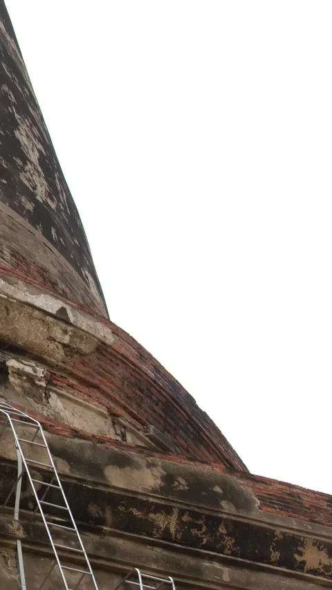 Low Angle Pan of Ancient Buddhist Stupa in Ayutthaya Stock Footage 346579762