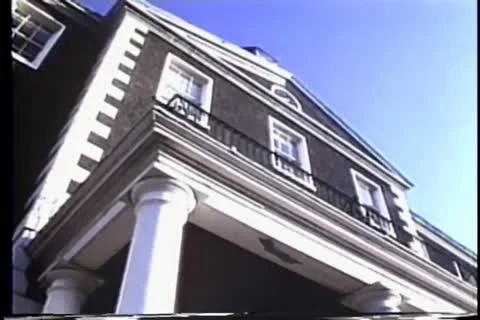 Low angle pan of  house to American Insurance Sign Stock Footage 11346319