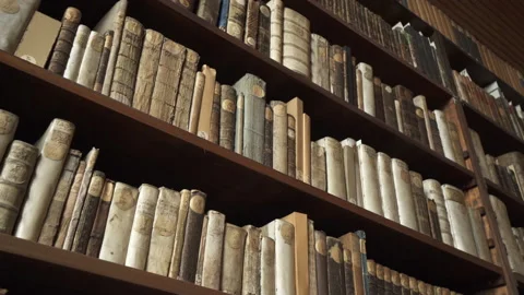 Low Angle Pan Of Library Books On A The Shelf Of An Old German Monastery, With Stock Footage 154593386