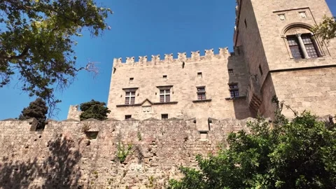 Low angle pan of Palace of the Grand Master facade and tower in Rhodes Stock Footage 340575851