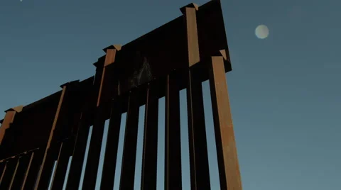 Low angle pan revealing end of border wall Stock-Footage 63441969