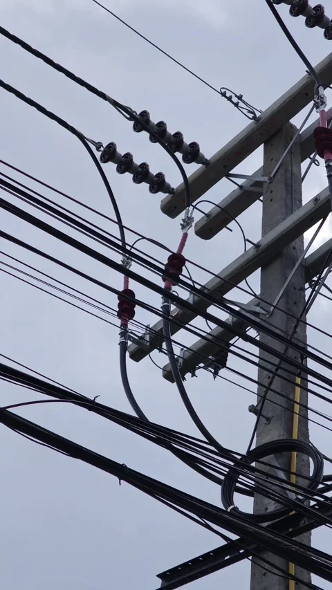 Low angle pan right video of a concrete power pole featuring complex. Stock Footage 338194841