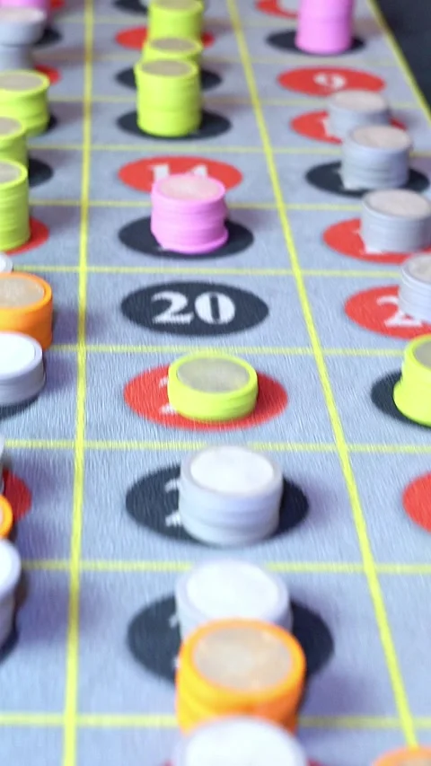 Low angle pan roulette table with chips casino scene Stock Footage 332511340