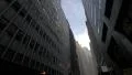 Low angle panning on NYC skyscrapers ending with Financial District street 4k or 4k+ Resolution