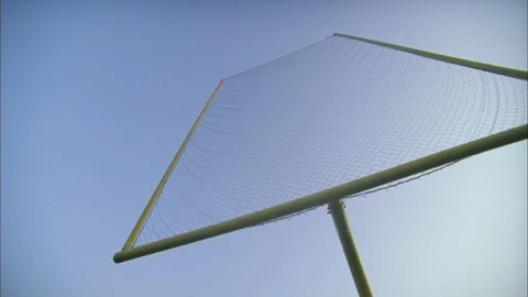 Low angle panning shot of practice goalpost in American football field Stock Footage 105422906