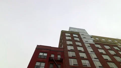 Low Angle Panning Shot Of Residential Building In City Against Sky - New York Stock Footage 243167341