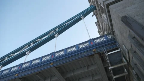 A low-angle panning shot of the Tower Bridge. Stock Footage 134195539