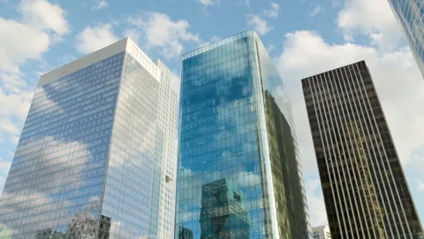 Low-angle panoramic architectural view of modern corporate glass skyscrapers in  Stock Footage 338027291