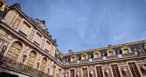 Low Angle Panoramic Orbit of Palace of Versailles Facade at Sunrise with Clear Stock Footage 320243527