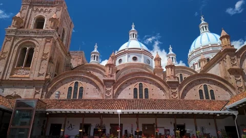 Low angle parallax of the New Cathedral brick towers facade against blue sky in Stock Footage 327831942