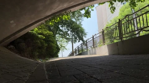 Low Angle Pedestrian Walkway Under Concrete Overpass in Seoul Stock Footage 338301269
