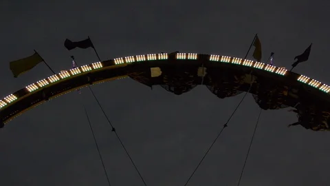 Low Angle of People Looping Upside down on Amusement Park Ride Stock Footage 92756756