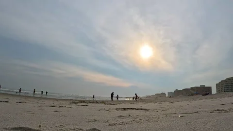 Low angle: People walk the sands of Rockaway Beach, Queens New York, 2023 Stock Footage 249019271