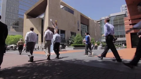 Low Angle of People Walking Down Town Charlotte NC Stock Footage 84270973