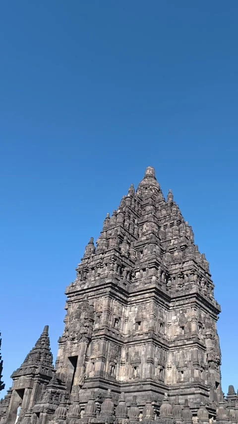 Low-angle perspective captures majestic Prambanan Temple towers and carved .. Stock Footage 341543365