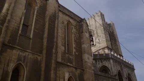 Low angle perspective of historic Lisbon cathedral tower in Portugal Stock Footage 347404769