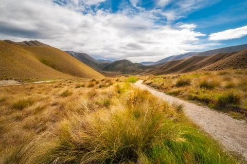 Low angle perspective view fom Lindis Pass Summit in New Zealand Stock Photos