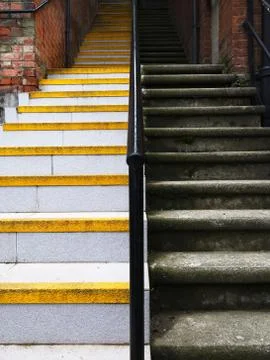 Low angle perspective view of two long stairs in different colors. Photos