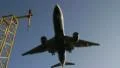 Low angle as plane comes in land HD Footage