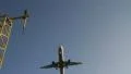 Low angle as plane comes in land HD Footage