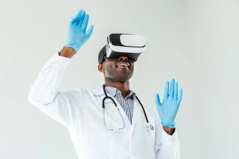 Low angle of pleasant smiling practitioner in VR glasses Stock-Fotos