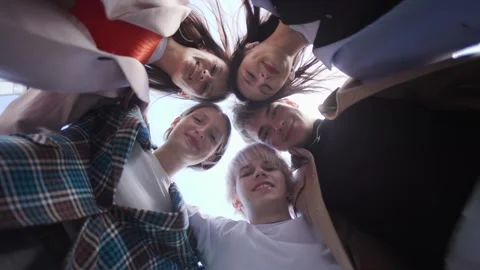 Low-angle portrait of a group of friends, all dressed in stylish outfits,look in Stock Footage 297468321