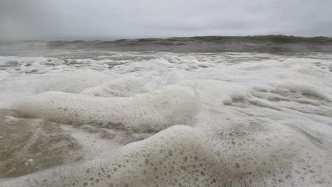 Low Angle Pov: Dirty, Muddy Rough Ocean Waves Rush Towards The Camera Stock Footage 254821193