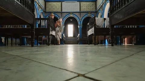 Low angle pov of el ghriba jewish synagogue of djerba in tunisia slow motion Video stock 280879585