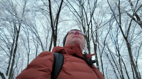 Low Angle POV Of Man Walking In Snowy Winter Forest 스톡 동영상 336659284