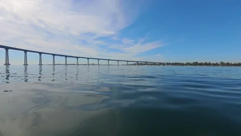 Low Angle POV Paddleboarding Toward Coronado Bridge - San Diego Bay Stock Footage 331489112