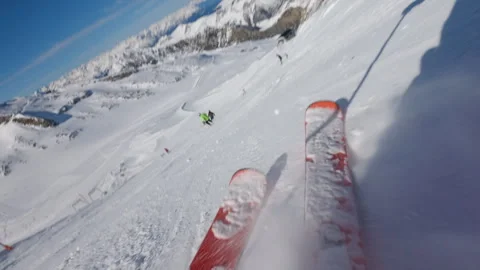 Low angle POV of skier going fast down the hill on sunny clear day Stock Footage 331257086