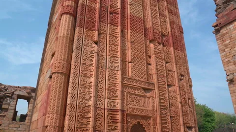 Low angle pull out view of carved red sandstone tomb of Iltutmish in New Delhi Stock Footage 342268764