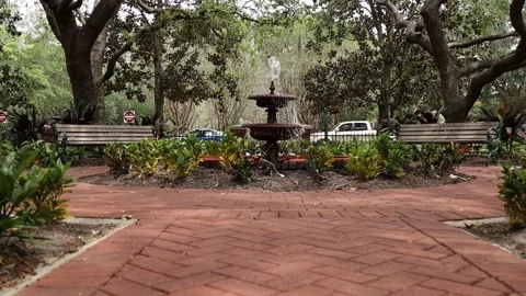 Low angle push in shot into fountain at park Video stock 245452761