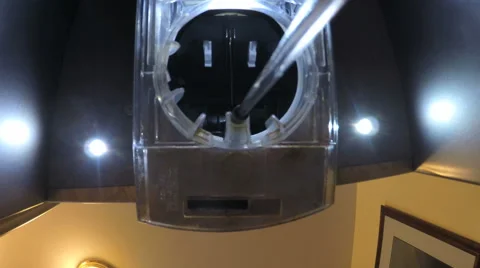 Low angle refrigerator drinking water spout pouring dispensing filtered H2O 4K Vidéo 67365257