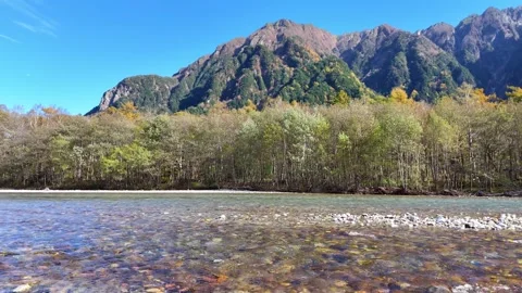 Low Angle River | Hotaka Mountains | Kamikochi Fall - 4K Video Stock Footage 329052602