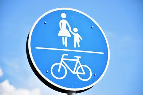 Low angle of a road sign against blue sky background Stock Illustration