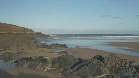 Low angle rocky beach shore, aerial Stock Footage 73807691