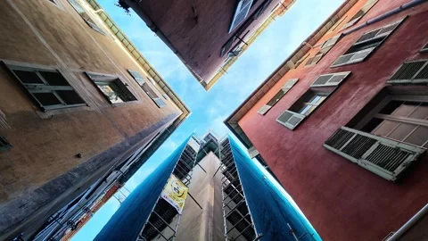 Low angle rotating shot of old town buildings and sky Stock Footage 336922683